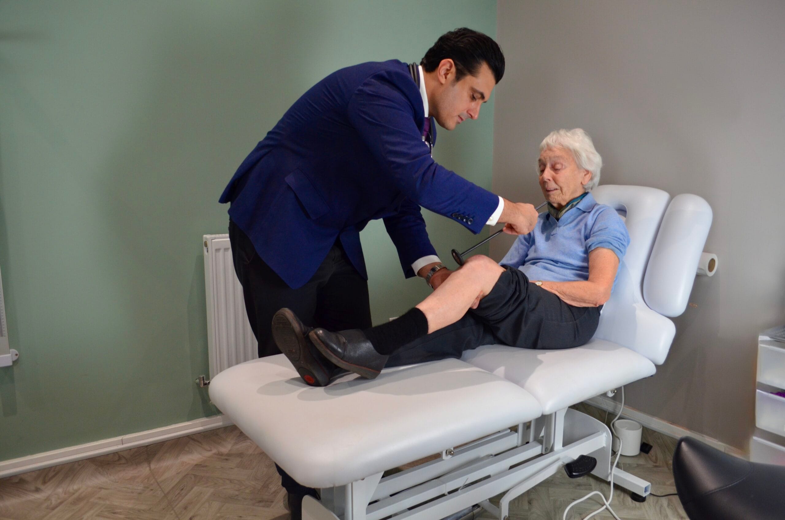 Doctor examining elderly patient at 360 Med clinic