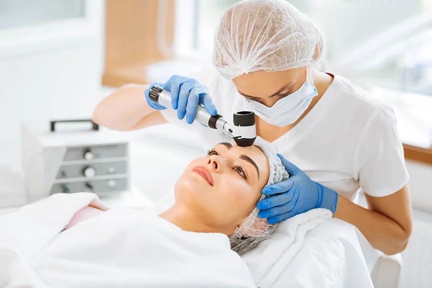 Doctor using eye examination device on patient